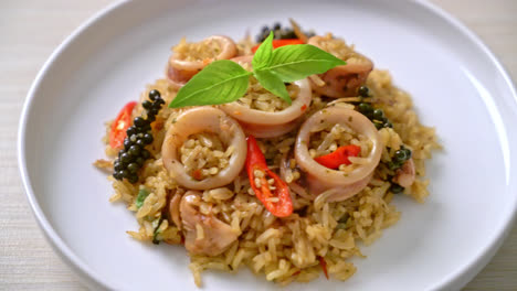 homemade basil and spicy herb fried rice with squid or octopus - asian food style