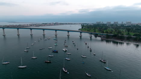 Flying-around-sailboats-anchored-near-Coronado-bridge-and-Coronado-Island