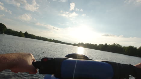 pov of sea doo ride during sunset on serene lake in michigan