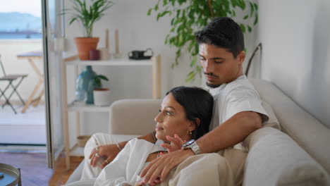 married people resting sofa closeup. romantic newlyweds relaxing together