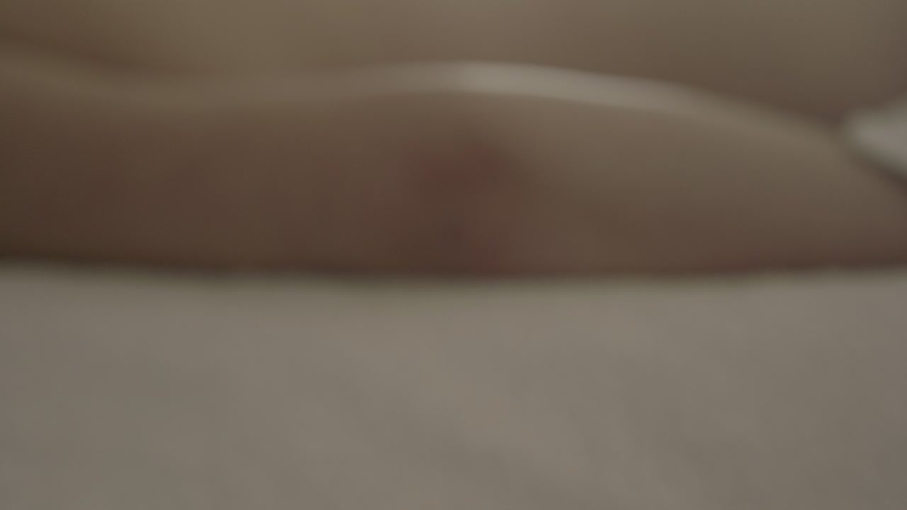 Vertical rise behind a massage bench, focusing from client to breathtaking mountain and lake view