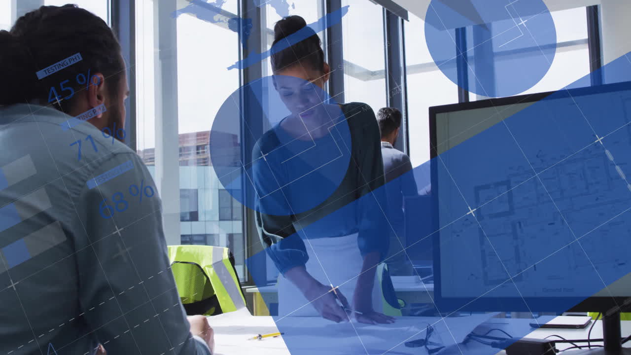 Reviewing architectural plans with digital data, businesswoman in modern office