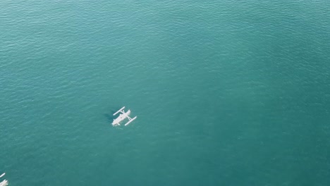 fly straight over the group of traditional white fishing boats via drone in bali 4k and 30 fps