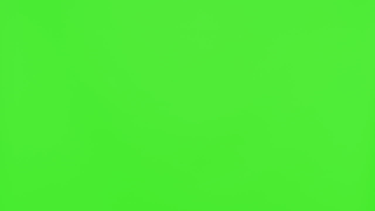 녹색 스크린 앞에서 손을 흔들고 있는 남자