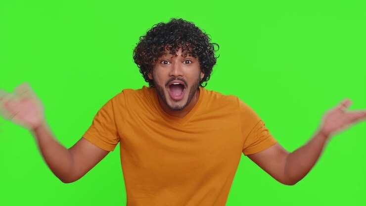 Man Waving in Front of Green Screen