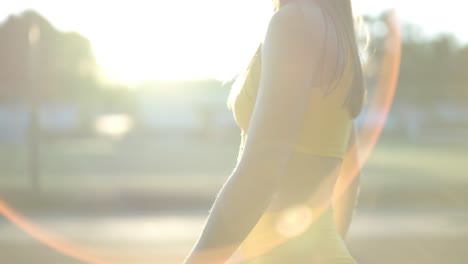 female athlete running on outdoor track in sportswear