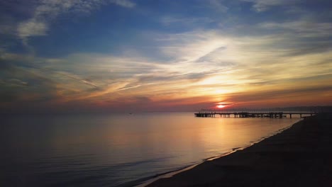 drone footage of a sunrise over the sea