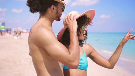 Laughing-couple-standing-on-shore