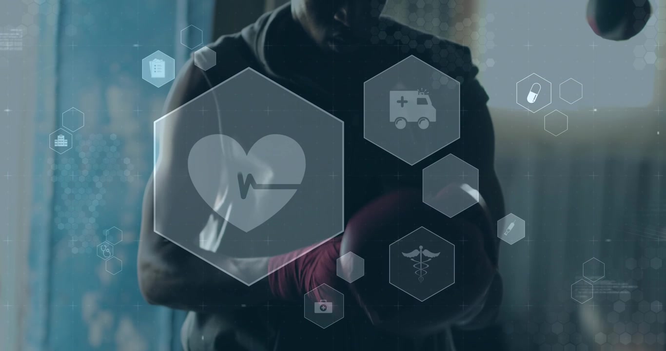Animazione di icone mediche e sanitarie su uomo afroamericano con guantoni da boxe in palestra