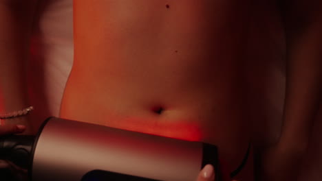 red light therapy treatment on a woman's body