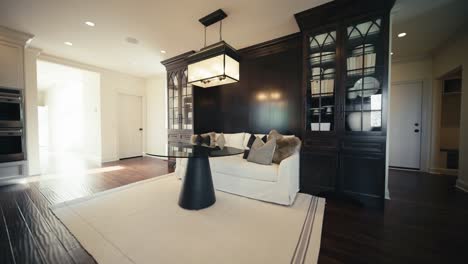 comfortable dinner table set up in the kitchen of a luxury home