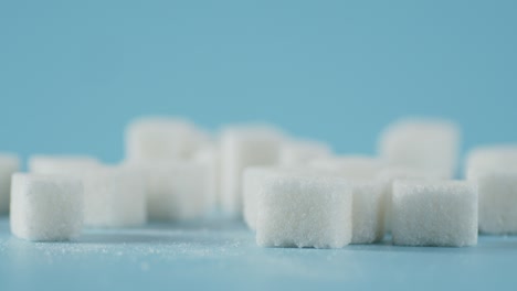 sugar cubes rotate slowly on the table.