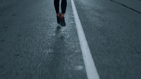 a man running in the middle of the road