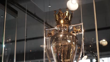 premier league trophy on display