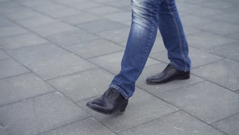 man walking on a city street