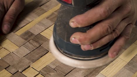 close shot of a machine sanding wood