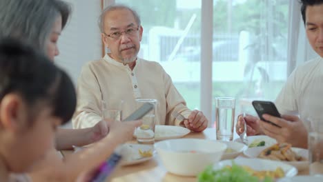 family dinner with smartphones