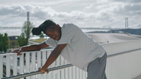 acrobatic performer rehearsing dance at sea background. talented man dancing