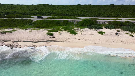 aerial-of-white-sand-beach-shoreline-with-crystal-clear-turquoise-water-on-Cozumel-Island-in-Mexico