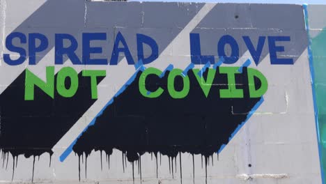 street art urges people to spread love not covid during the covid19 coronavirus pandemic epidemic