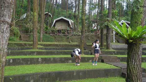 couple stretching in a tropical forest resort