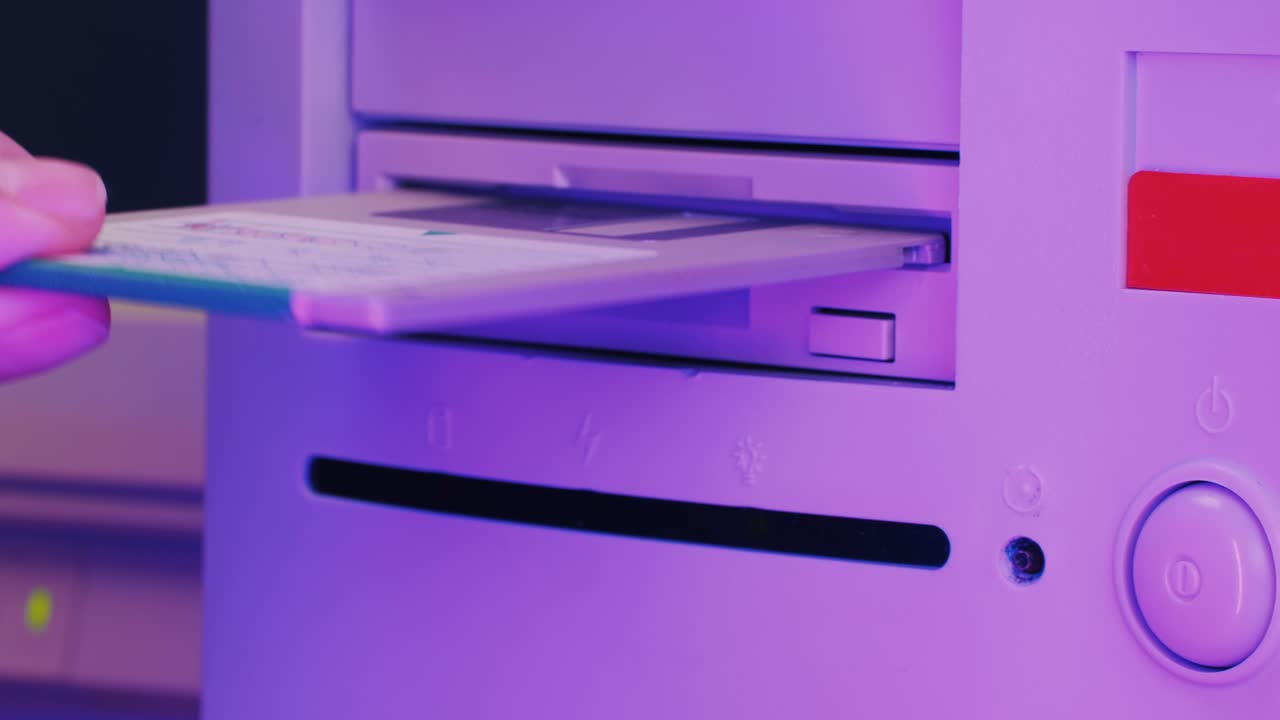 Vintage Computer with Floppy Disk Insertion