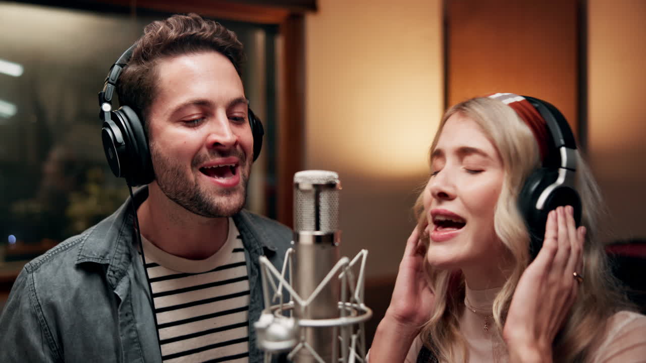 Couple singing in a recording studio