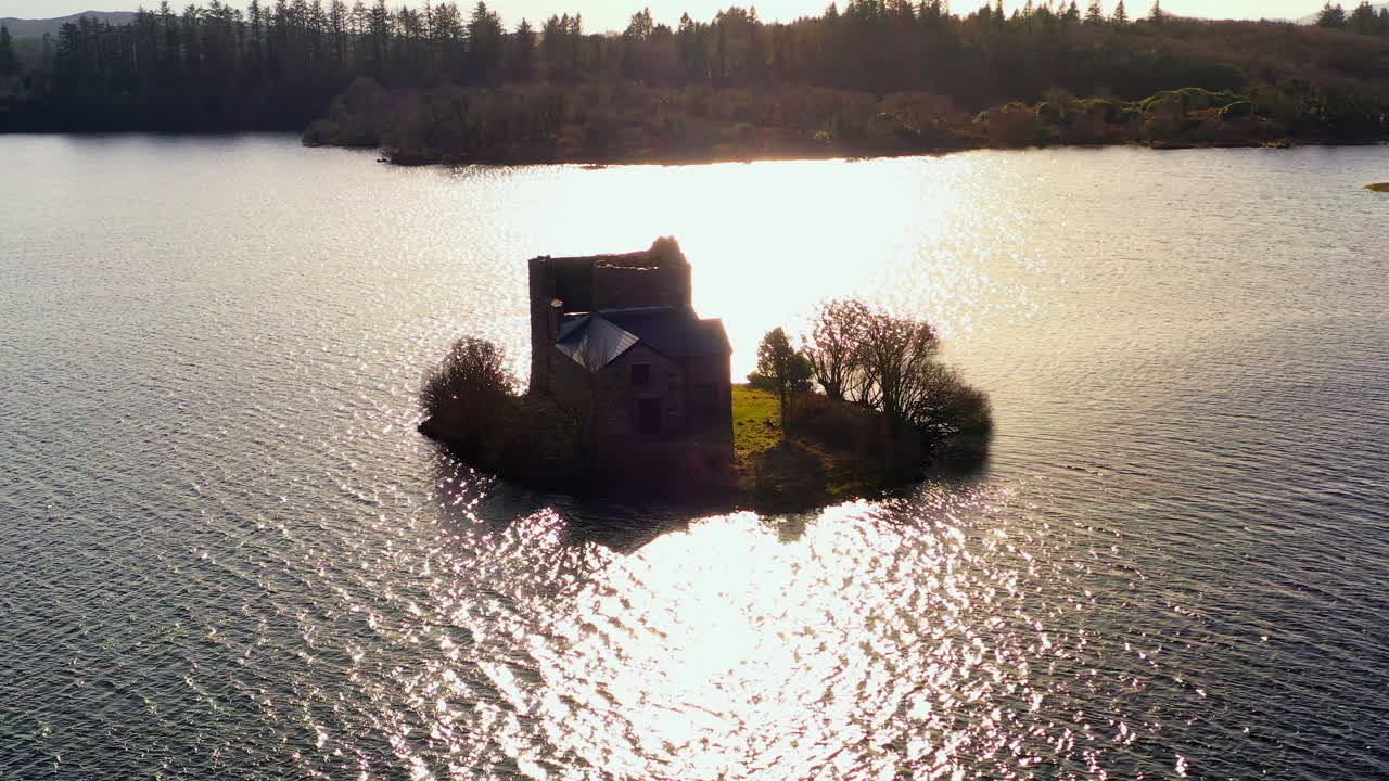 Aerial drone shot of Ballynahinch Castle, beautifully backlit for an establishing view.
