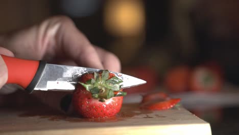 cutting and slicing strawberry using a knife