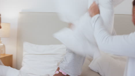 bedroom, pillow fight and child with parents