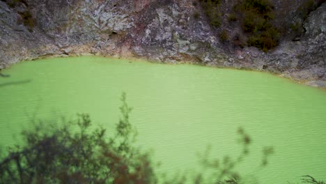 devi's bath neon green sulphuric lake in rotorua new zealand, a geothermal wonderland