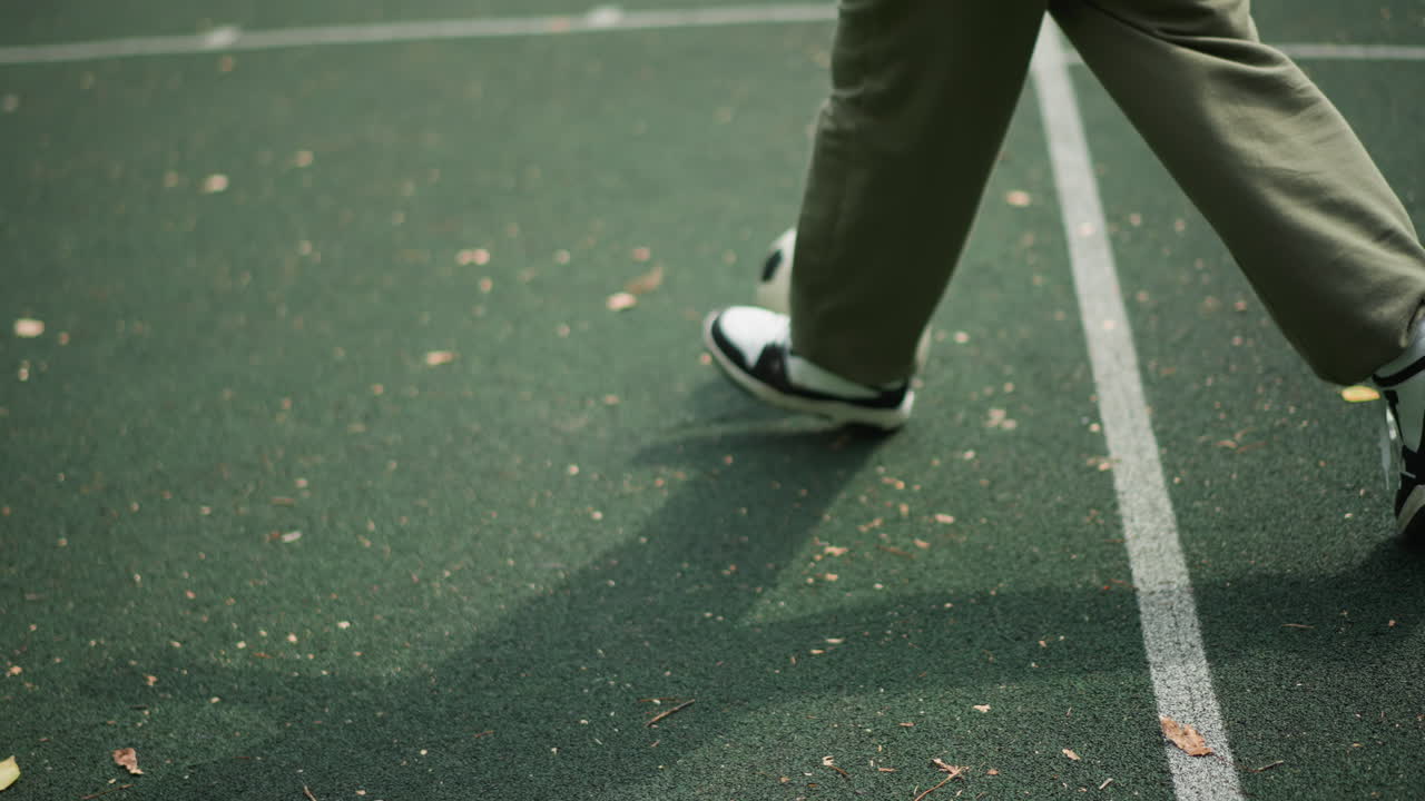 Lax Ball Movement, Leisurely Soccer Practice Displaying Steady Rhythm Amid Autumn Scenery, Casual Dribbling Along Boundary With Seasonal Foliage Showing Calm Rhythm And Natural Environment