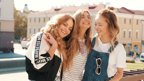 three friends laughing outdoors