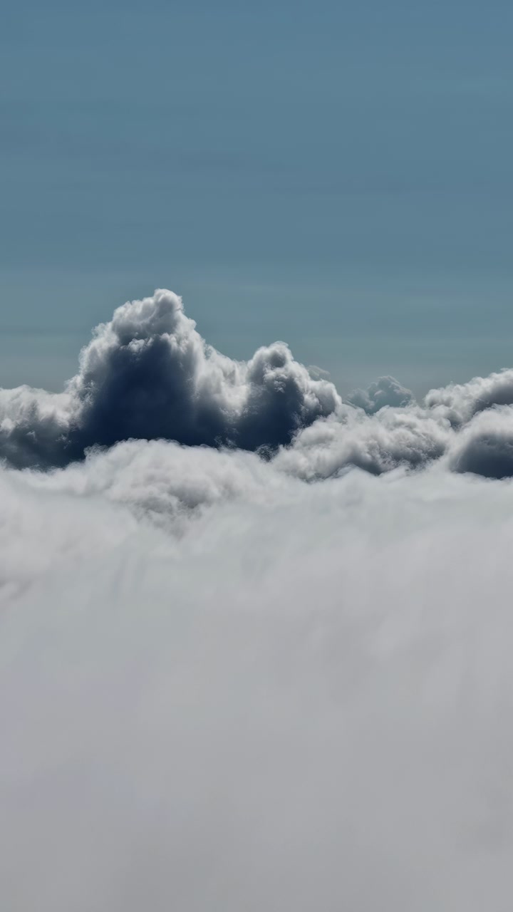 Puffy clouds create a dramatic scene against a vivid blue sky, perfect for weather or nature projects.