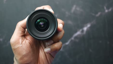 top view of holding a camera lenses ,