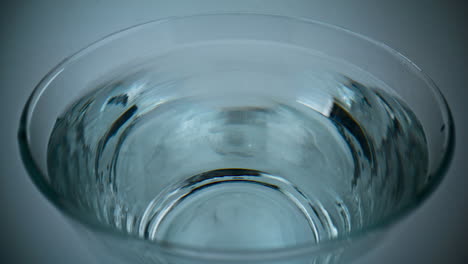 clean water drop falling slow motion macro. filtered beverage blob calm surface