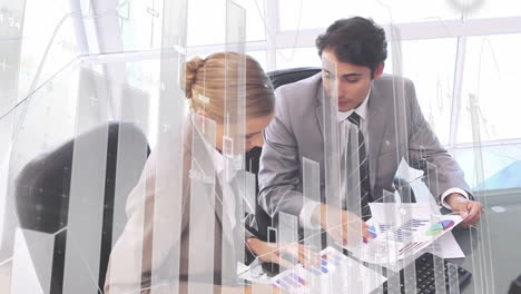 analyzing charts, business professionals in office with financial data animation overlay