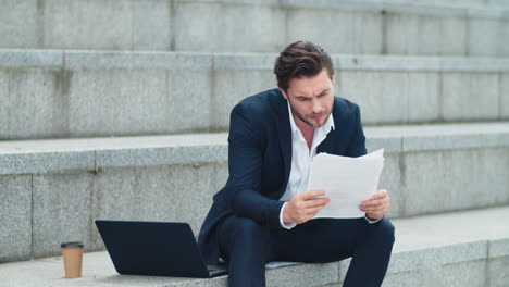 man reading documents