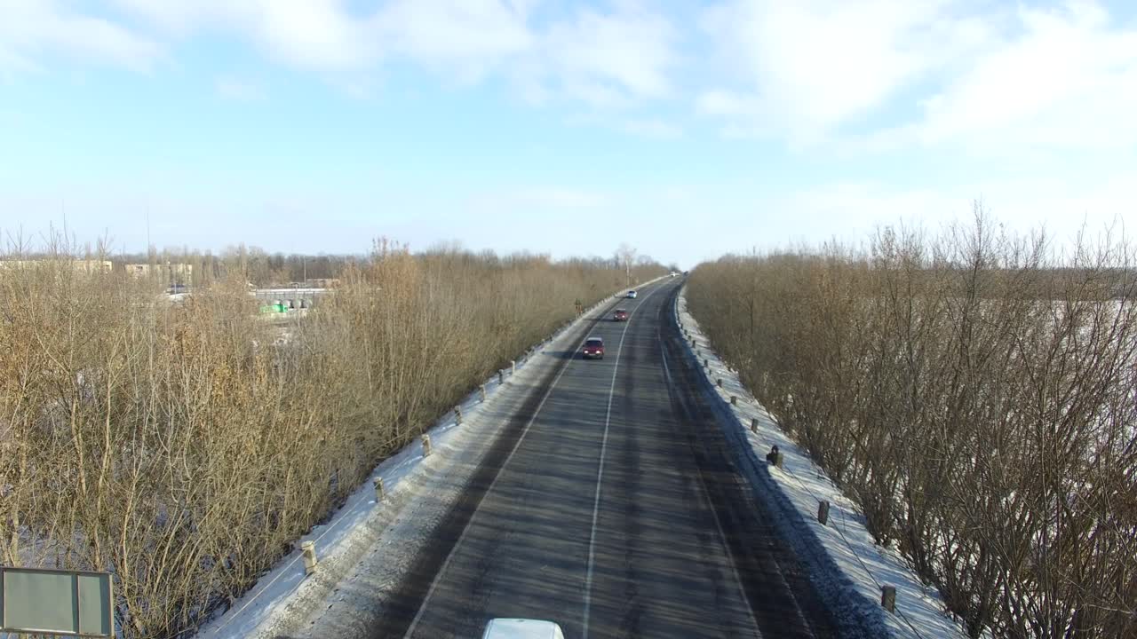 Highway in winter day. Aerial view of motorway in winter season