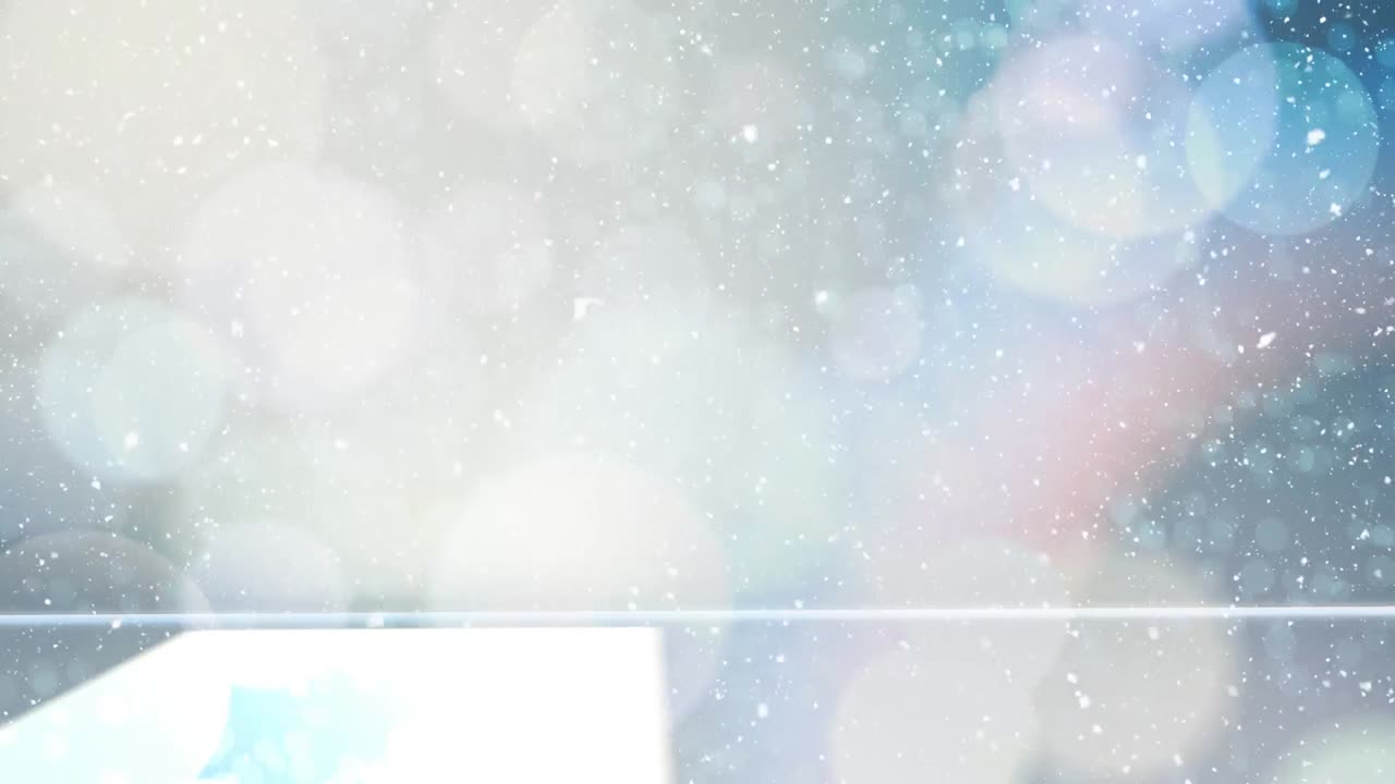 보케 빛의 크리스마스 원과 함께 눈이 내리고 있습니다.