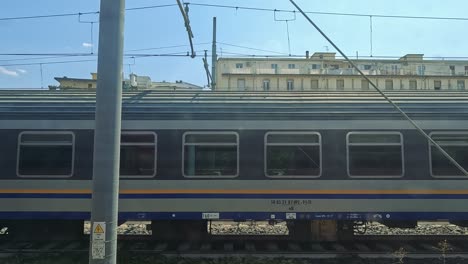 a train moves through urban naples landscape