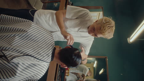 Professional Asian Barber Giving Haircut to Man