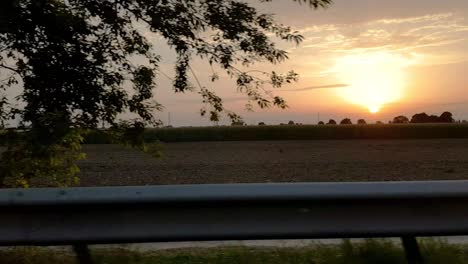 Traveling-fast-on-the-German-autobahn-during-sunset