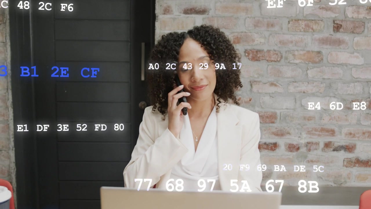 Code overlays appearing, causing woman glancing at laptop, lifting phone, calling for work info