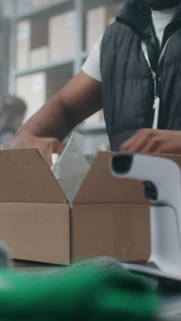 warehouse workers packing boxes