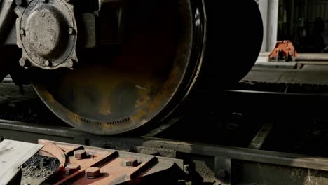 vintage train wagon moving on industrial tracks, showcasing motion and history