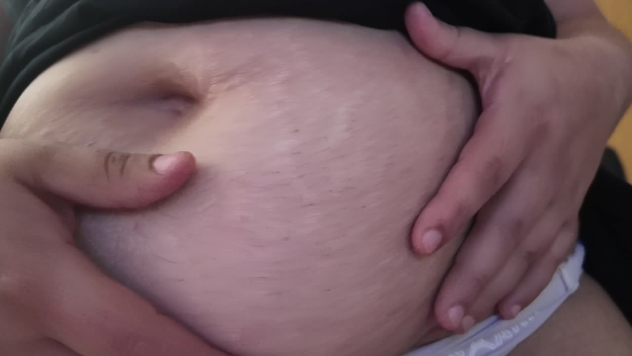 Belly fat of obese person, close up, slow motion