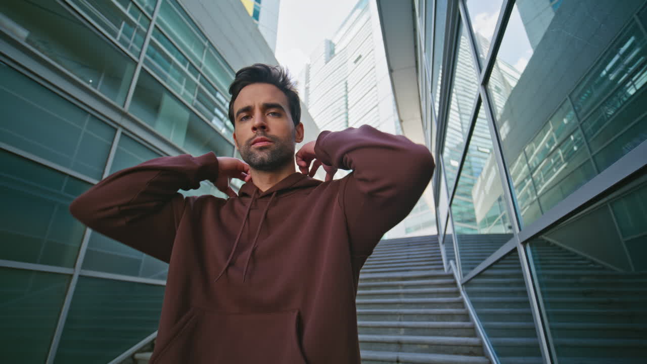Athletic man running town stairs. Closeup guy pausing looking camera
