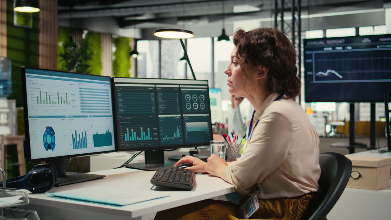 Vertical Video Female employee in a high end office analyzing performance metrics