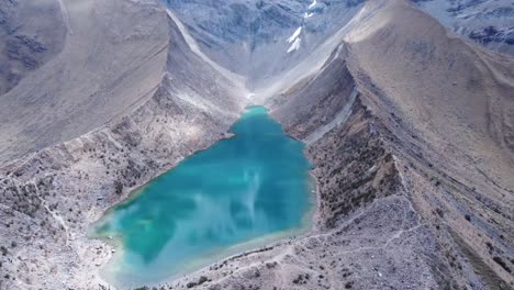 aerial view of humantay lake, or laguna humantay in andes mountain range in peru